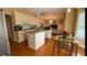 Bright, open-concept kitchen featuring a center island and stainless steel appliances at 1008 Post Horn Run, Lawrenceville, GA 30045
