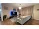Comfortable living room with modern lighting, a stylish glass table, and an entertainment center at 1008 Post Horn Run, Lawrenceville, GA 30045