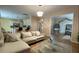 Cozy living room featuring a comfortable sofa, stylish decor, and open access to the kitchen at 1008 Post Horn Run, Lawrenceville, GA 30045