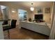 Bright living room featuring a white sofa, modern lighting, and stylish decor at 1008 Post Horn Run, Lawrenceville, GA 30045