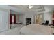Bright main bedroom with tray ceilings, neutral walls, and a sitting area with natural light at 1008 Post Horn Run, Lawrenceville, GA 30045