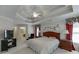 Well-lit main bedroom with tray ceilings, ample closet space, and calming ambiance at 1008 Post Horn Run, Lawrenceville, GA 30045