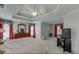 Spacious main bedroom with tray ceilings, red curtains, and a cozy atmosphere at 1008 Post Horn Run, Lawrenceville, GA 30045