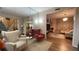Sitting area with ample seating, a decorative mirror, and an open layout at 1008 Post Horn Run, Lawrenceville, GA 30045