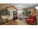 Charming sitting area featuring a unique hanging chair and comfortable seating at 1008 Post Horn Run, Lawrenceville, GA 30045