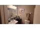 Updated bathroom with modern fixtures, vanity, toilet and decor at 1638 Raleigh Cir, Marietta, GA 30067