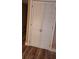 Hallway closet with shuttered doors and wood floors at 1638 Raleigh Cir, Marietta, GA 30067