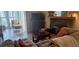 Comfortable living room features a stone fireplace, wood floors, and modern furnishings at 1638 Raleigh Cir, Marietta, GA 30067