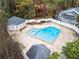 Aerial view of the community pool with a sundeck and fenced-in area surrounded by mature trees at 1638 Raleigh Cir, Marietta, GA 30067