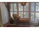 Cozy sunroom showcasing plantation shutters and an elegant chaise lounge for a relaxing atmosphere at 1638 Raleigh Cir, Marietta, GA 30067