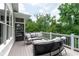 Relaxing back deck with comfortable seating area surrounded by a lush wooded landscape at 2909 Redding Road Northeast, Atlanta, GA 30319