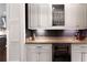 Bar area featuring white cabinetry, stone countertop, and a wine fridge at 2909 Redding Road Northeast, Atlanta, GA 30319