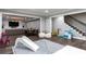 Basement with recreational space, dining table and stairs with black metal railing at 2909 Redding Road Northeast, Atlanta, GA 30319
