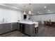 Basement kitchenette with island seating and open living space with TV and dining area at 2909 Redding Road Northeast, Atlanta, GA 30319