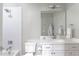Cozy bathroom with white tiled shower, and bright vanity with white countertop and modern fixtures at 2909 Redding Road Northeast, Atlanta, GA 30319