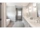 Bright bathroom featuring a freestanding tub, double sink vanity, and a glass enclosed shower at 2909 Redding Road Northeast, Atlanta, GA 30319