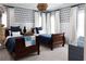 Bedroom with two wooden beds, navy and white color scheme, and playful zebra wallpaper at 2909 Redding Road Northeast, Atlanta, GA 30319