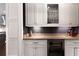 Butler's pantry features glass cabinets, a wine fridge, and a countertop at 2909 Redding Road Northeast, Atlanta, GA 30319