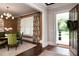 Dining area features a dining table with green chairs and view into the open front entrance at 2909 Redding Road Northeast, Atlanta, GA 30319