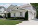 Charming two-story home featuring a well-manicured lawn and a three car garage at 2909 Redding Road Northeast, Atlanta, GA 30319