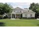 Charming two-story home with a well-manicured lawn and inviting front porch at 2909 Redding Road Northeast, Atlanta, GA 30319