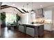 Modern kitchen featuring a large island, stainless steel appliances, and an adjacent dining area at 2909 Redding Road Northeast, Atlanta, GA 30319