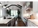 Bright kitchen features white cabinets, an island, stainless appliances, and a vaulted ceiling at 2909 Redding Road Northeast, Atlanta, GA 30319