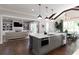 This kitchen features a center island, hardwood floors, and connects to a living room and dining area at 2909 Redding Road Northeast, Atlanta, GA 30319