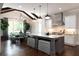 Bright kitchen features white cabinets, an island, stainless appliances, and a vaulted ceiling at 2909 Redding Road Northeast, Atlanta, GA 30319