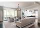 Bright living room with hardwood floors, modern furnishings, and a view of the back porch at 2909 Redding Road Northeast, Atlanta, GA 30319