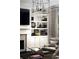 Close up on a living room fireplace, bookshelf, and chair at 2909 Redding Road Northeast, Atlanta, GA 30319