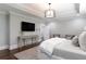 Spacious main bedroom featuring a tray ceiling, hardwood floors, and neutral colored decor at 2909 Redding Road Northeast, Atlanta, GA 30319