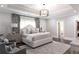 Elegant main bedroom with a large bed, soft lighting, tray ceiling, and stylish decor at 2909 Redding Road Northeast, Atlanta, GA 30319