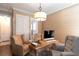 This well-lit office features a desk, comfortable seating, and a neutral color scheme at 2909 Redding Road Northeast, Atlanta, GA 30319