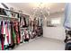 Large walk-in closet with custom shelving, hanging rods, and ample storage for clothing and accessories at 2909 Redding Road Northeast, Atlanta, GA 30319