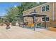 Spacious backyard patio with outdoor kitchen, dining area, and gazebo for entertaining at 3244 Beechwood Se Dr, Marietta, GA 30067