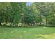 Expansive backyard featuring lush green lawn and mature trees at 3244 Beechwood Se Dr, Marietta, GA 30067
