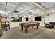 Spacious basement featuring a pool table, bar area, and tv for entertaining at 3244 Beechwood Se Dr, Marietta, GA 30067