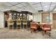 Basement bar with seating and stocked shelves for all your entertainment needs at 3244 Beechwood Se Dr, Marietta, GA 30067