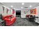 Finished basement with a large TV, sofas and Atlanta Falcons decor throughout at 3244 Beechwood Se Dr, Marietta, GA 30067