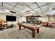Wide angle view of the basement, featuring a pool table and fully stocked bar at 3244 Beechwood Se Dr, Marietta, GA 30067