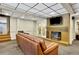 Cozy basement featuring a brick fireplace and comfortable seating area at 3244 Beechwood Se Dr, Marietta, GA 30067