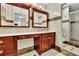 Bathroom featuring dual sinks, vanity area, and a glass-enclosed shower for a luxurious experience at 3244 Beechwood Se Dr, Marietta, GA 30067