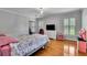 Cozy bedroom with hardwood floors, twin beds, and natural light creates a comfortable space at 3244 Beechwood Se Dr, Marietta, GA 30067