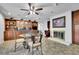 Elegant dining area with custom cabinets, granite counters, and a cozy fireplace for intimate gatherings at 3244 Beechwood Se Dr, Marietta, GA 30067