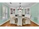 Formal dining room with built-in china cabinets, chandelier, and ample seating for dinner parties at 3244 Beechwood Se Dr, Marietta, GA 30067