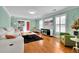 Bright living room with hardwood floors, white sofa, and fireplace, perfect for relaxation and entertaining at 3244 Beechwood Se Dr, Marietta, GA 30067