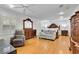 Spacious main bedroom suite with hardwood floors, decorative furnishings, and a sitting area at 3244 Beechwood Se Dr, Marietta, GA 30067