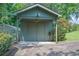 Backyard view of a small shed and greenhouse in a backyard at 3244 Beechwood Se Dr, Marietta, GA 30067