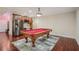 Finished basement featuring a pool table and stainless steel wet bar at 4480 Egret Ave, Cumming, GA 30041